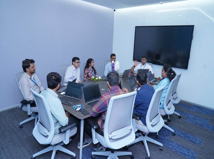 PrimeSoft team collaborating in a meeting room