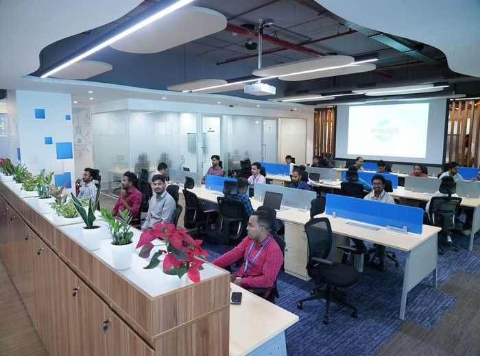 PrimeSoft workspace with collaborative seating and plants